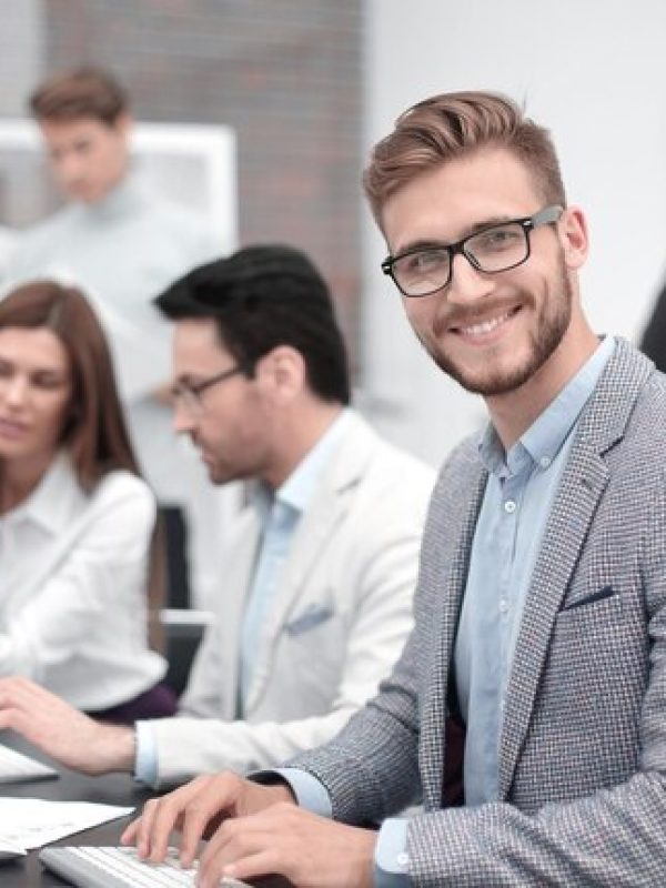 smiling-businessman-workplace-people-technology_252847-15476